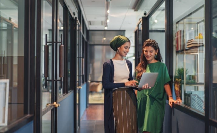 Two businesswomen chatting